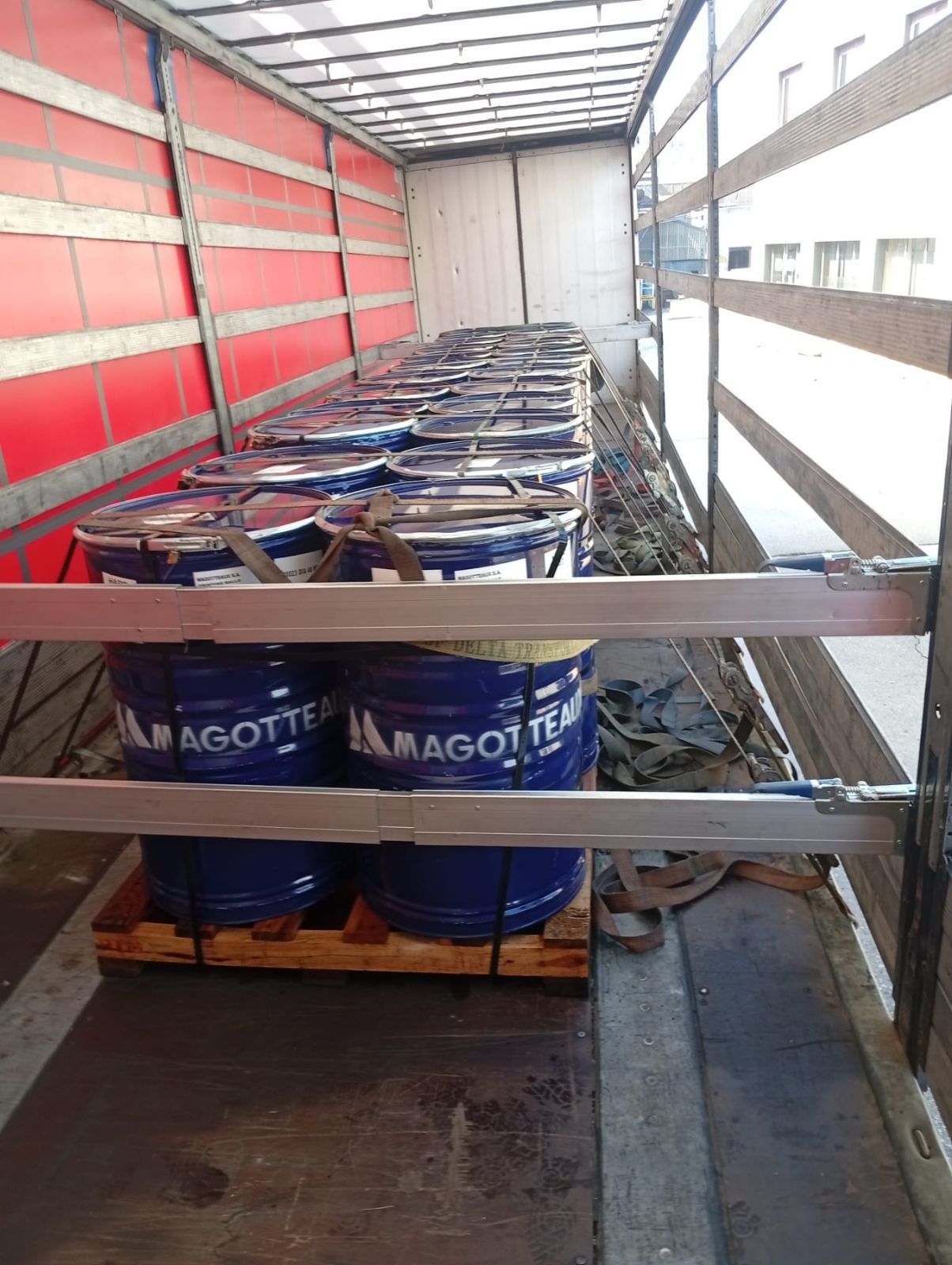 Steel drums secured inside trailer